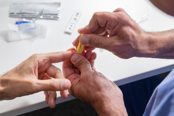 blood sample being taken from a finger