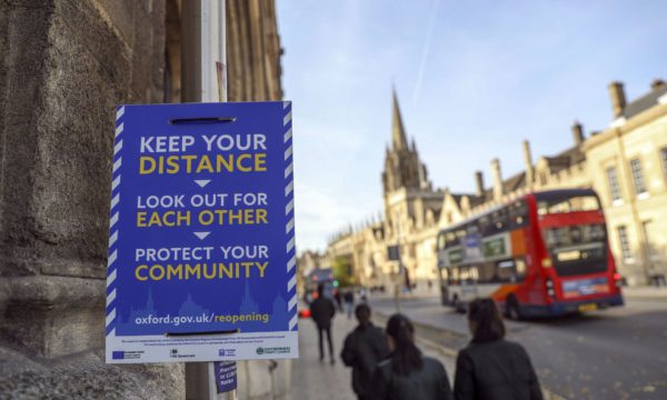 street sign in front of a busy street. Photo credit: Steve Parsons/PA Wire