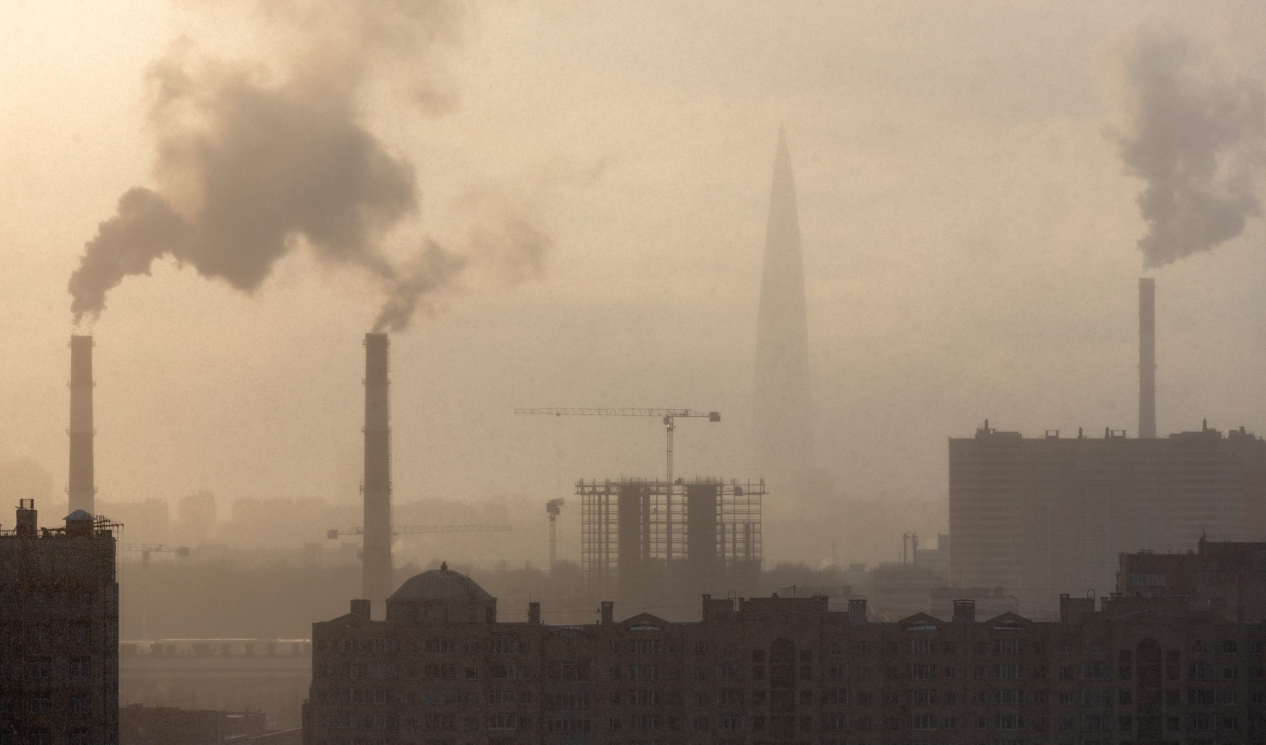 Chimneys with smoke in the city