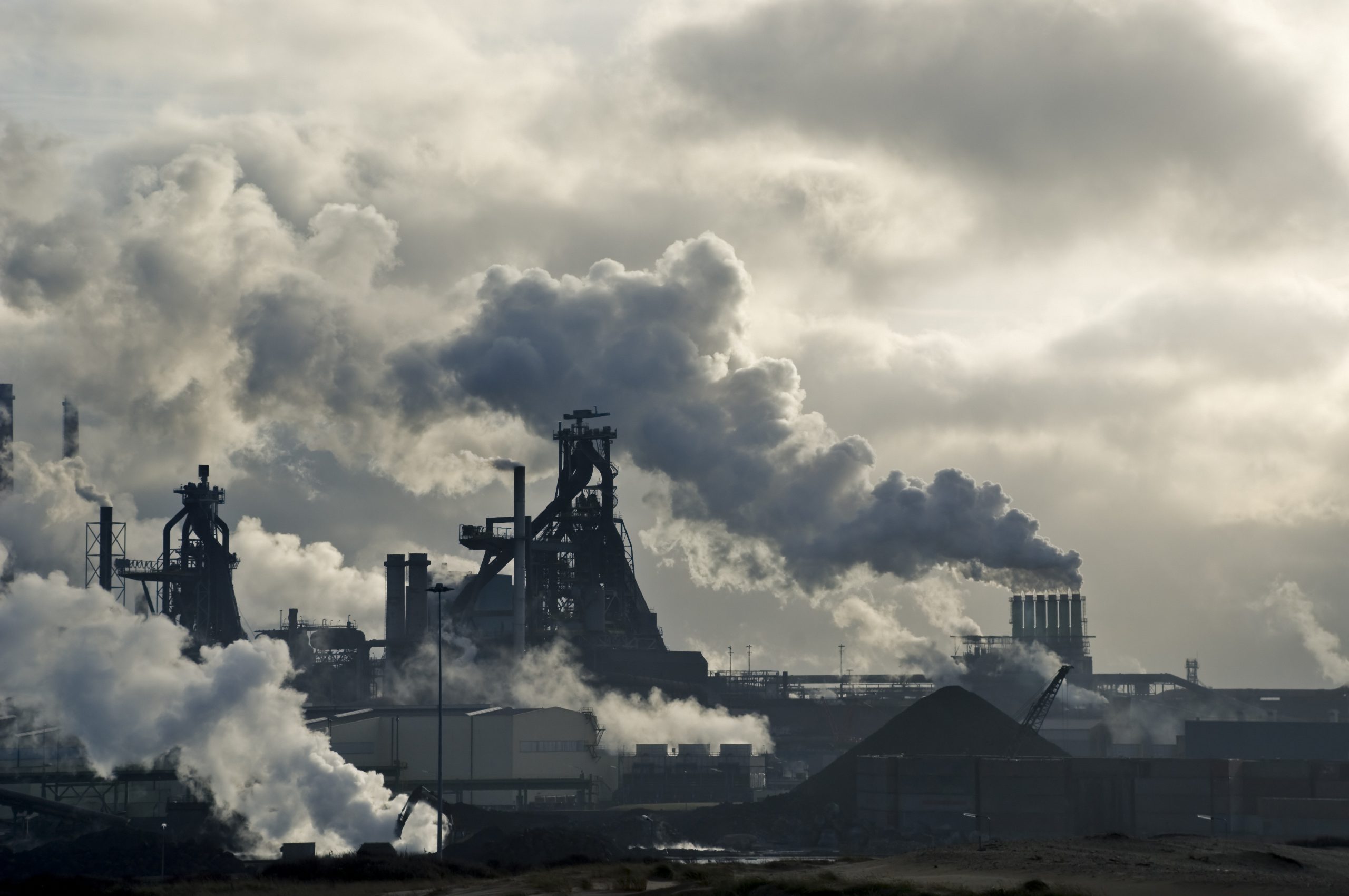 Lots of smoking chimneys in a dark environment Smoke from factories
