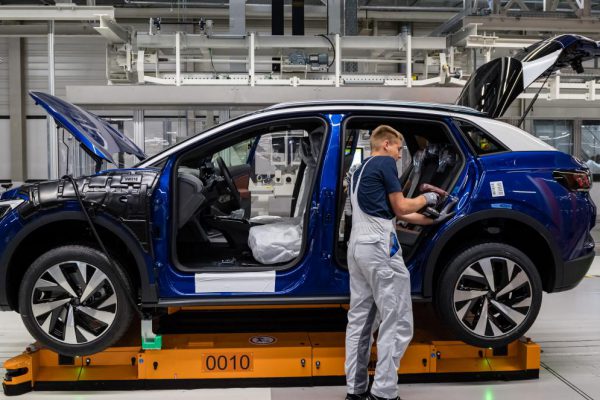 Person working on an electric car