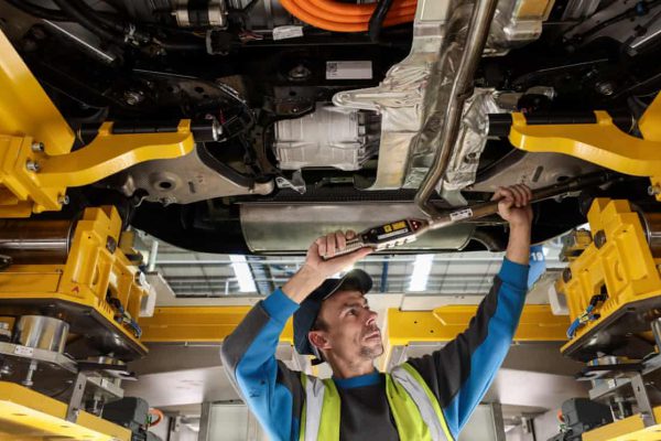 Mechanic working under a car